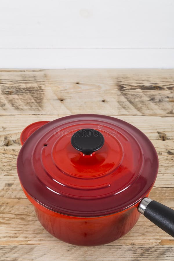 Red saucepan on table stock photo. Image of cooking, colour 71914946
