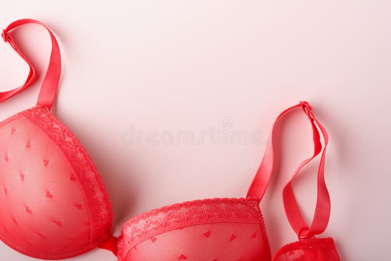 Red Bra and Panties on Pink Background. Women Underwear Set with