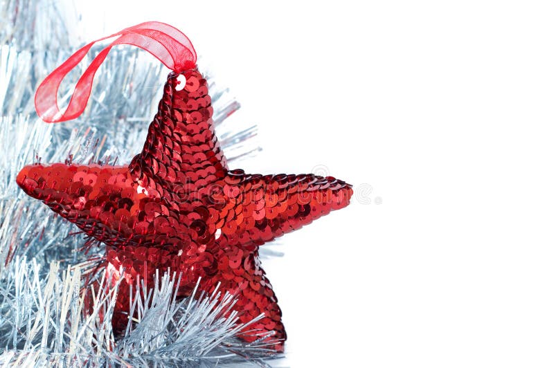 Red shiny star decoration with silver tinsel