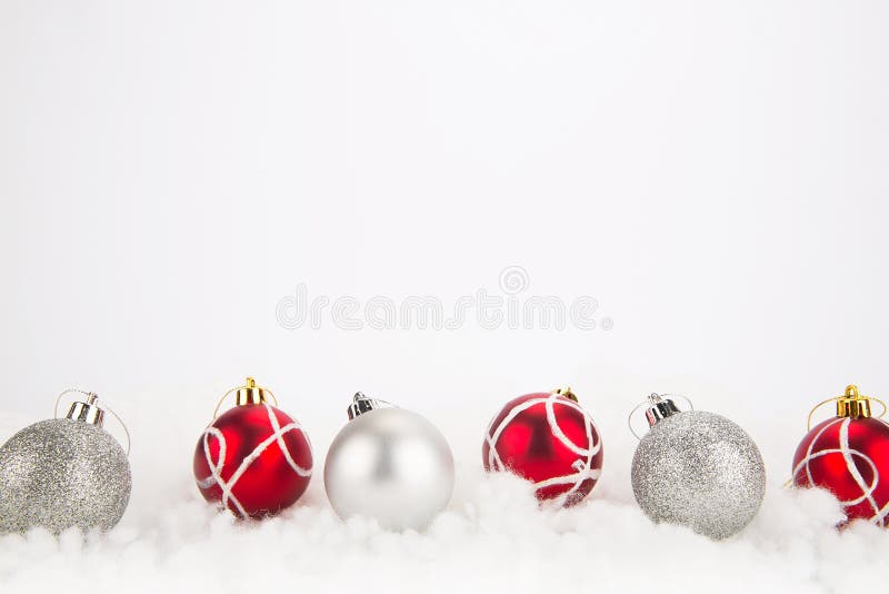 Red and silver Christmas balls on abstract background