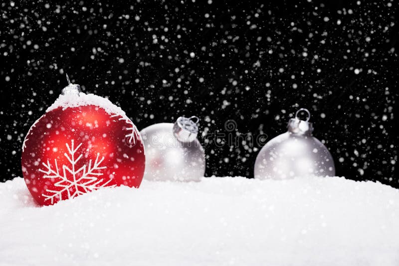 Red and silver christmas balls in snow stock photography Red and silver christmas balls in snow stock photography