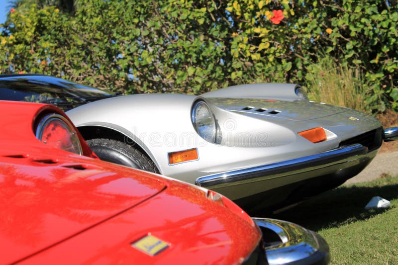 Classic grey silver Ferrari Dino 246 GT sports car in line up next to red dino 246 GT sports car at Cavallino 2012. Classic grey silver Ferrari Dino 246 GT sports car in line up next to red dino 246 GT sports car at Cavallino 2012.