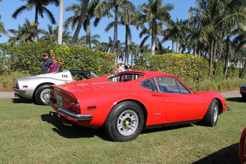 Classic red ferrari dino 246 gt berlinetta sports car in line up next to silver dino 246 gt spider sports car at cavallino 2012. rear corner. 03. Classic red ferrari dino 246 gt berlinetta sports car in line up next to silver dino 246 gt spider sports car at cavallino 2012. rear corner. 03