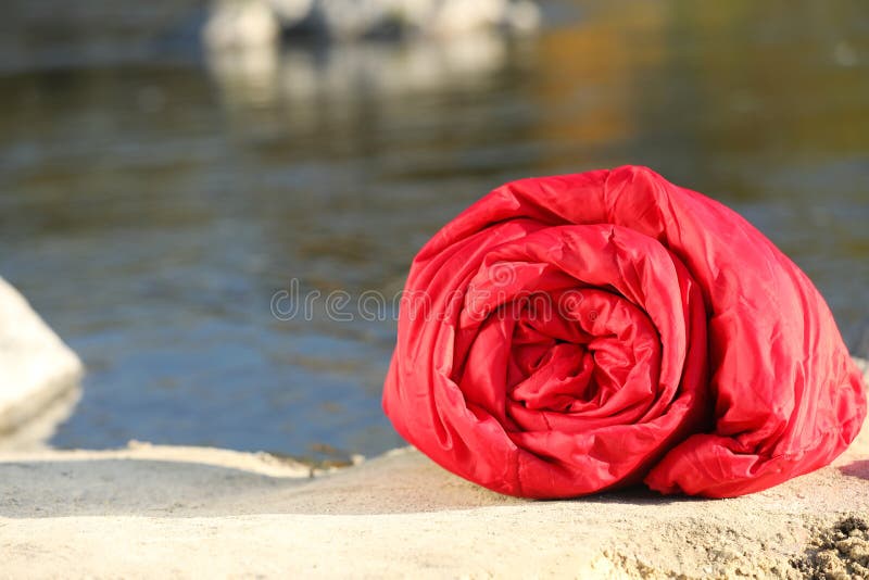 Red Sleeping Bag on Ground Outdoors, Space for Text. Stock Image ...