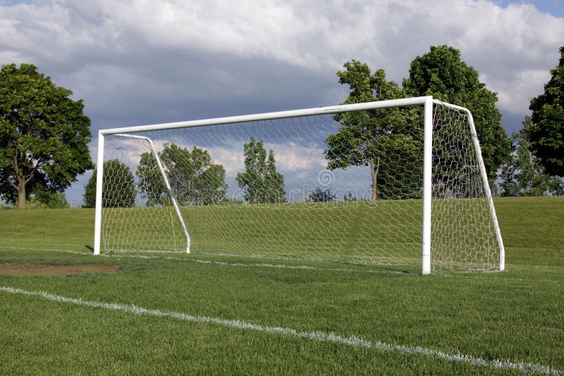 A view of a net on a vacant soccer pitch. A view of a net on a vacant soccer pitch.