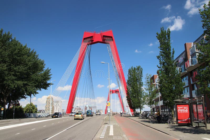 Red steel suspension bridge named Willemsbrug in the city center of Rotterdam over river Nieuwe Maas in the Netherlands stock photos Red steel suspension bridge named Willemsbrug in the city center of Rotterdam over river Nieuwe Maas in the Netherlands stock photos
