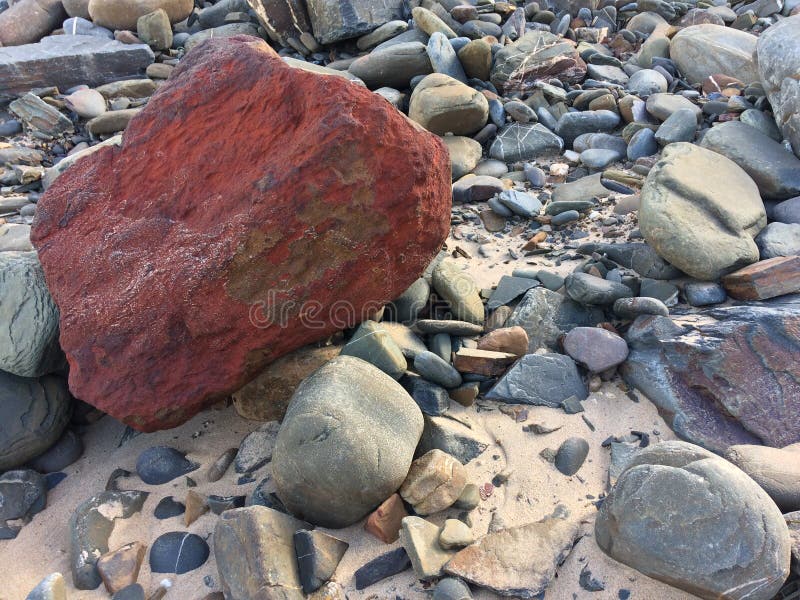 Red Stone, Unusual Stone, Be Bright, Stand Out from the Crowd Stock Image -  Image of unusual, stand: 138530017