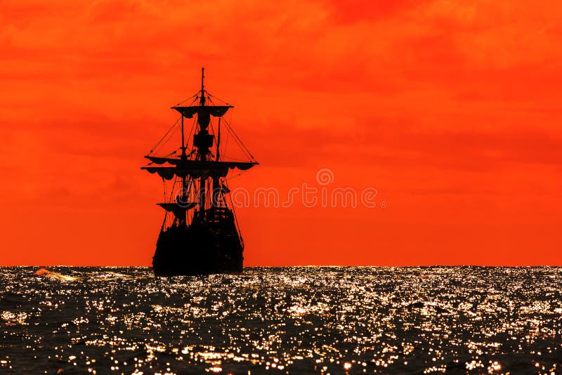 Red sunset silhouette tallship stock photos Red sunset silhouette tallship stock photos