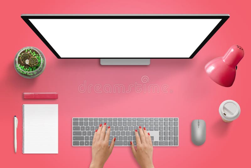 Red surface with computer monitor, keyboard and mouse. Isolated blank screen for mockup. Plant, lamp, coffee, pad, pencil, marker beside. Free space in the middle for text.