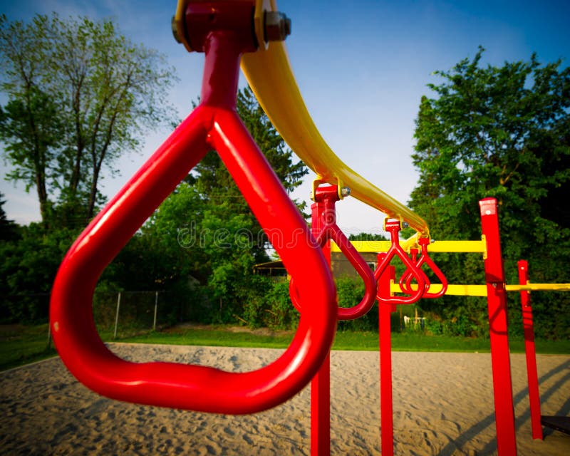 Red Swing Bars on Outdoor Play Structure