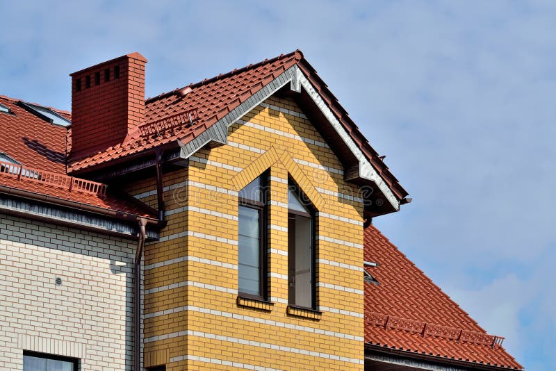 Attic windows on tile roof stock photo. Image of wall 102351010