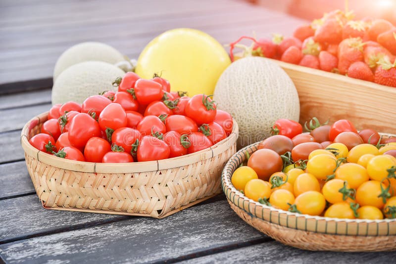 Red tomatoes; melon and Strawberries in the basket fresh from fa