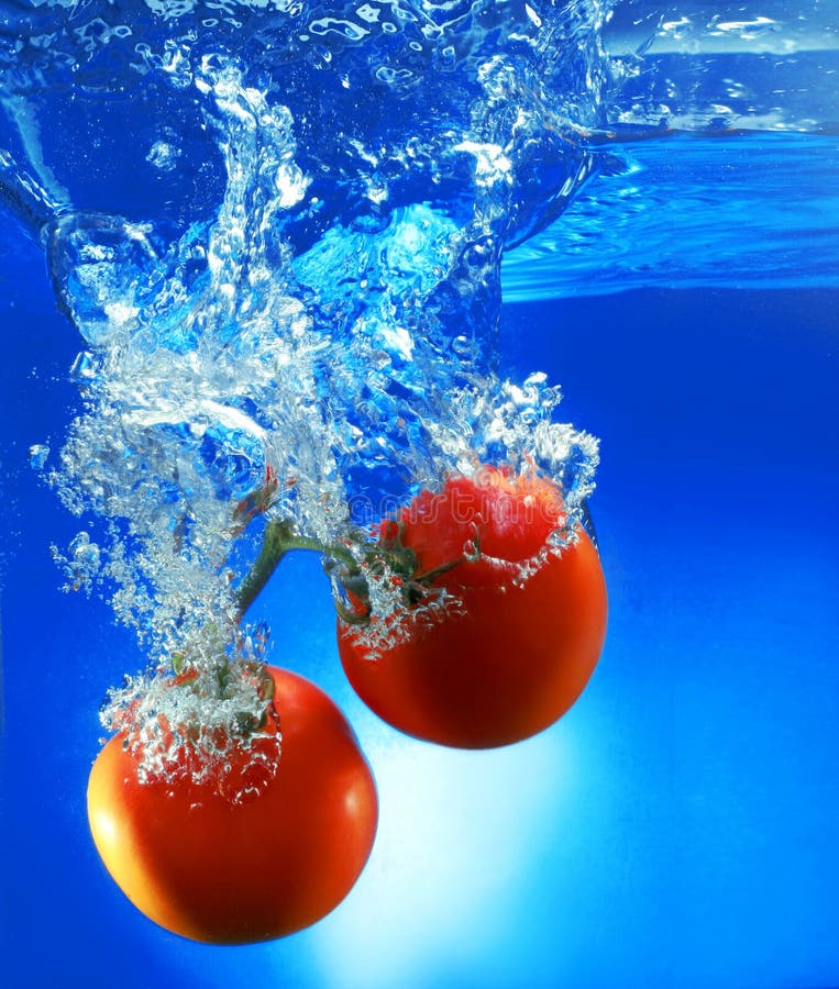 Red tomatoes in water