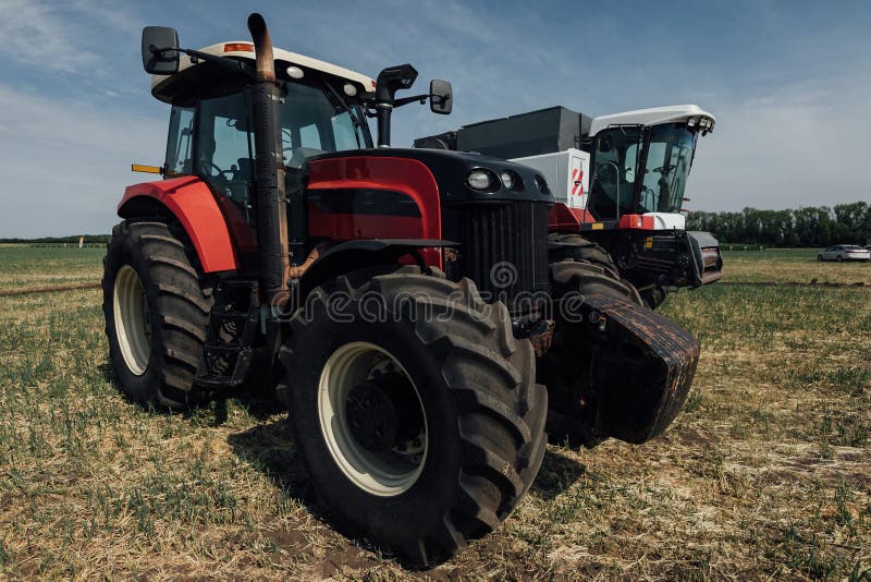 Red Tractor with Large Wheels in the Field during Tests during the