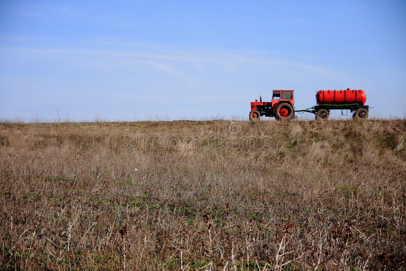 Red Tractor with Water Tank Stock Image Image of blue, wheel 12410745