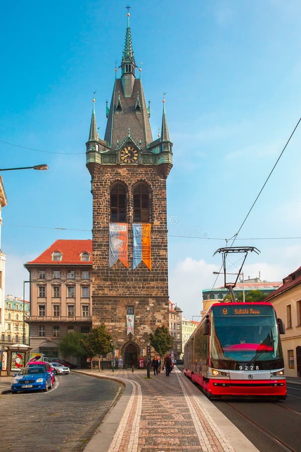 Red tram near Jindrisska Tower in Prague, Czech