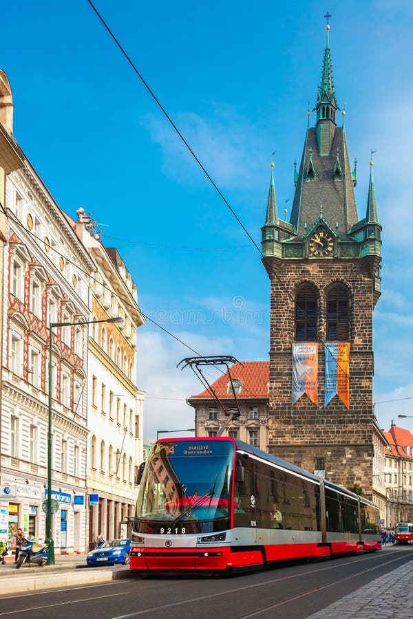 Red tram near Jindrisska Tower in Prague, Czech