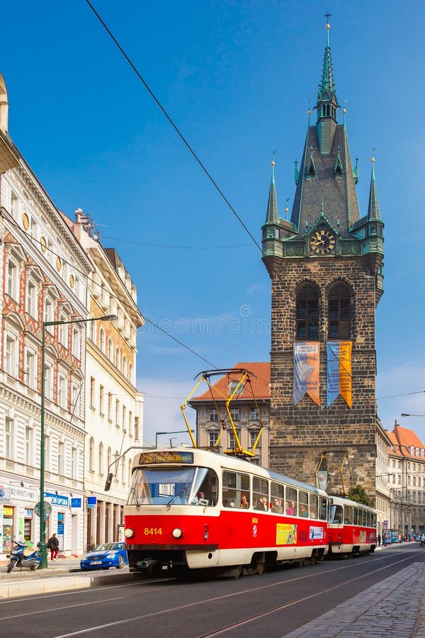 Red tram near Jindrisska Tower in Prague, Czech