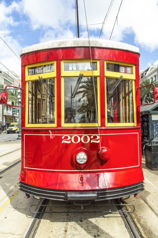 Red trolley streetcar on rail in New Orleans French Quarter