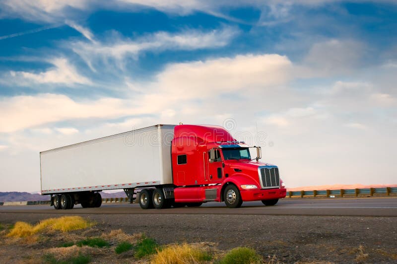 Red truck moving on a highway