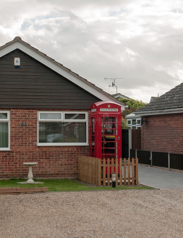 English Village Scene With Red Telephone Box Stock Photo
