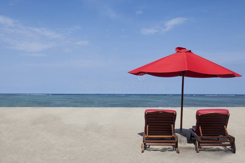 Red umbrella and two chairs