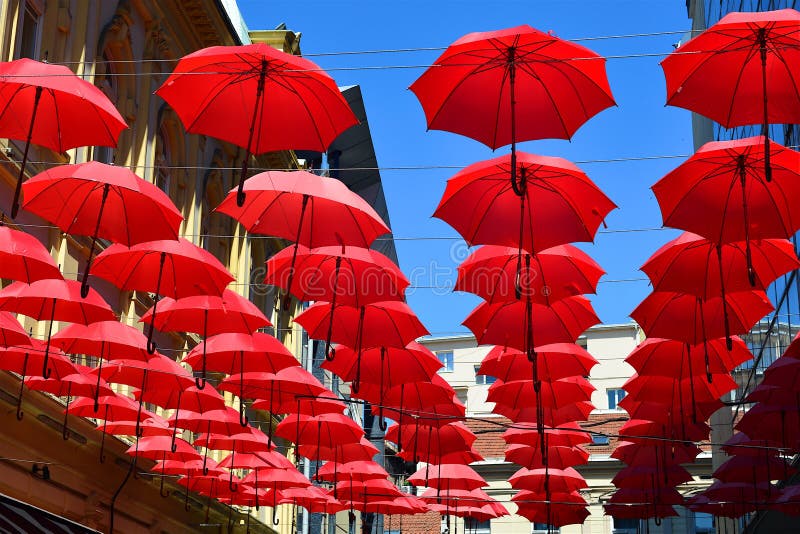 Umbrellas Suspended and Joined with Each Other in a Street of Poble