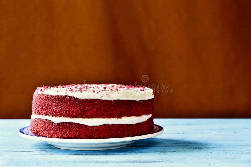 Red velvet cake on a blue wooden table stock image
