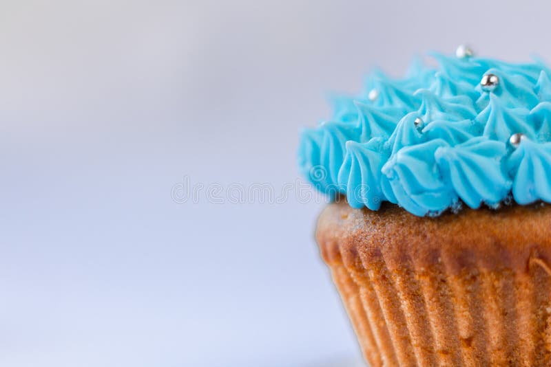 Blue custard cupcake, confectionery, sweet-stuff royalty free stock photography Blue custard cupcake, confectionery, sweet-stuff royalty free stock photography