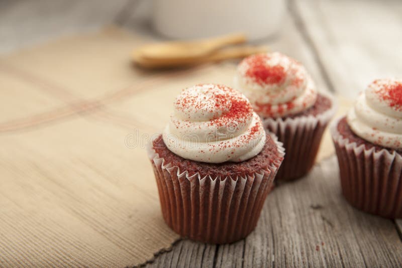 Red velvet cupcake on rustic table top