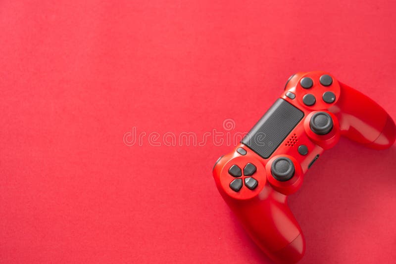 Red video game controller on a red background