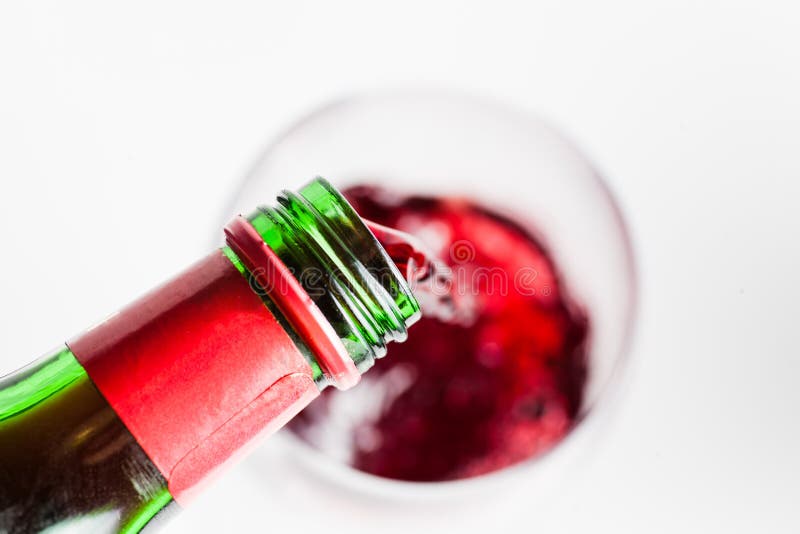 Red vine pouring into glass