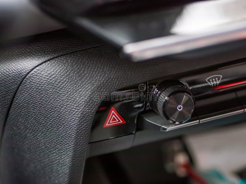 The Red Warning Light Button and Multimedia Switch Inside a Citroen C5