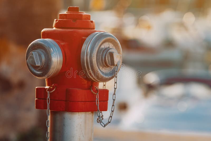 Red water hydrant on the street royalty free stock image