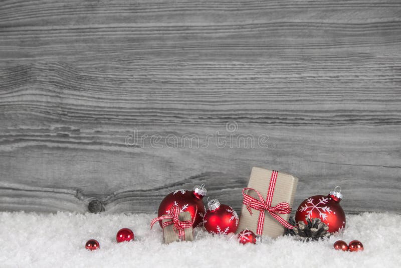 Red white checked christmas presents on old grey wooden backgrou