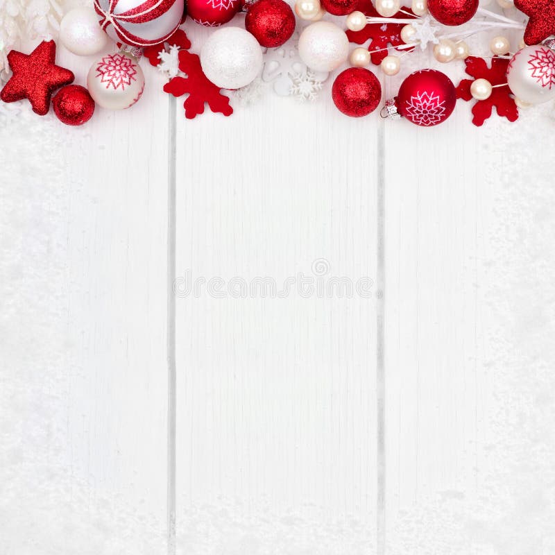 Red and white Christmas ornament top border over white wood