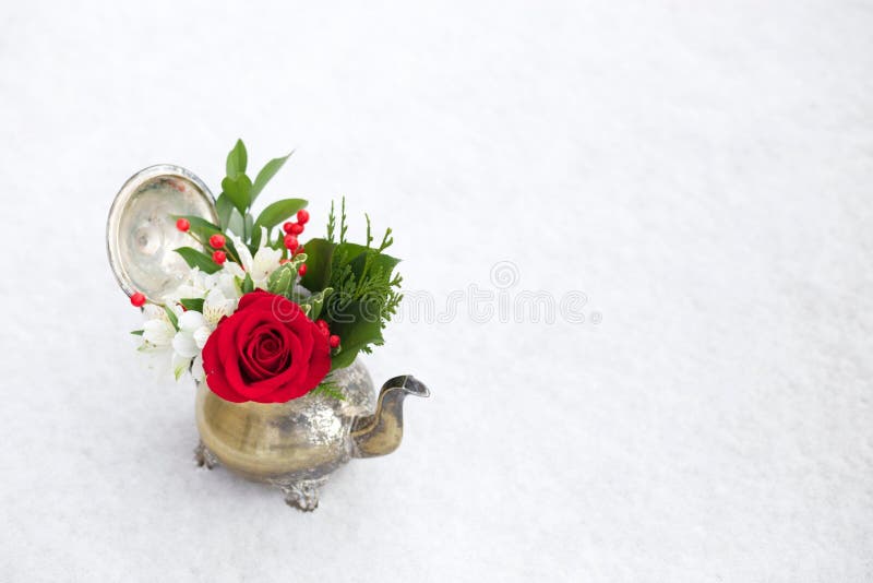 Red and White floral arrangement in antique teapot