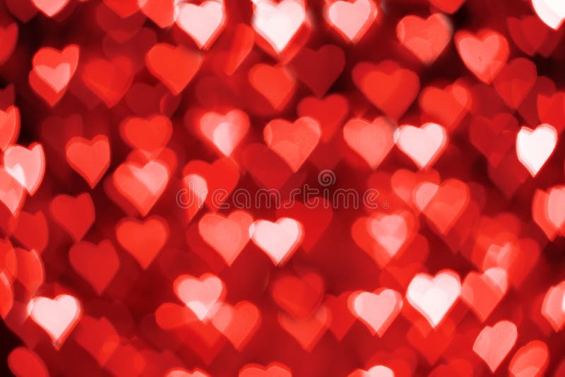 Red and white hearts bokeh as background for Valentine&x27;s day