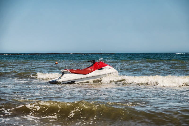 Red and White Jet Ski Splashing on Waves Stock Image Image of surf