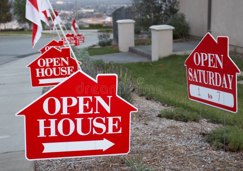 Red and white open house signs