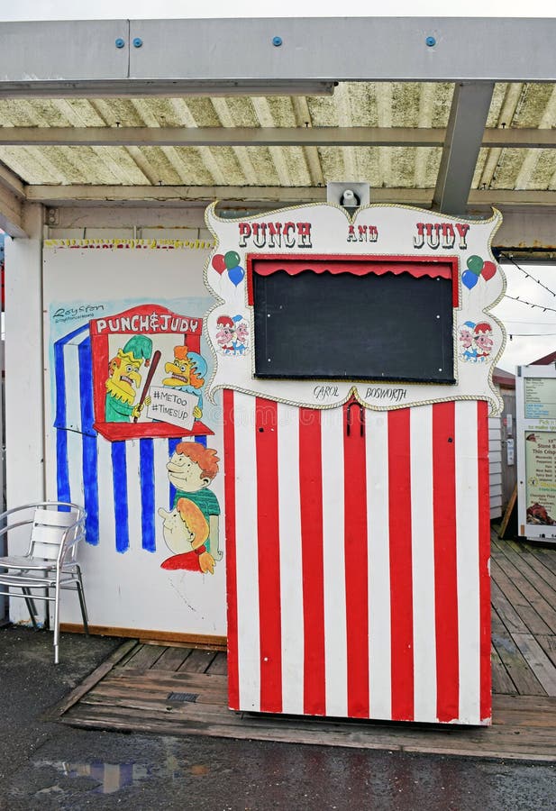 A red and white Punch and Judy Stand