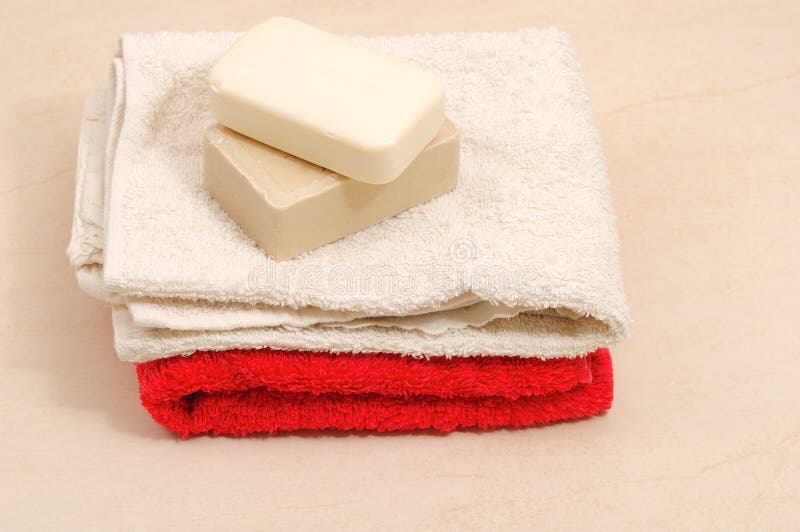 Red and white towels and honey