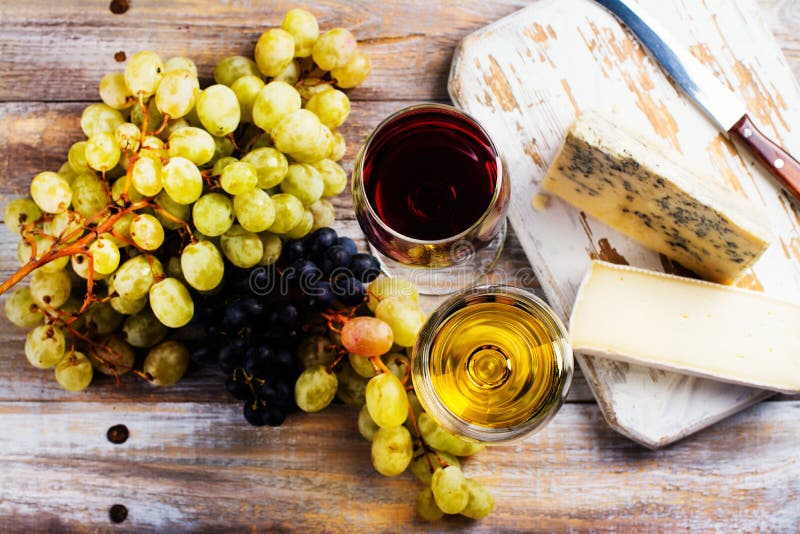 Red and White Wine and Assortment of Cheese Stock Image Image of