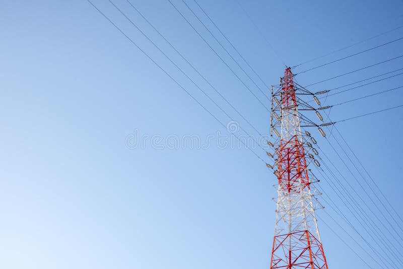 Red and white wired Electric cable Telecom post with blue sky background, technology concept royalty free stock image Red and white wired Electric cable Telecom post with blue sky background, technology concept royalty free stock image