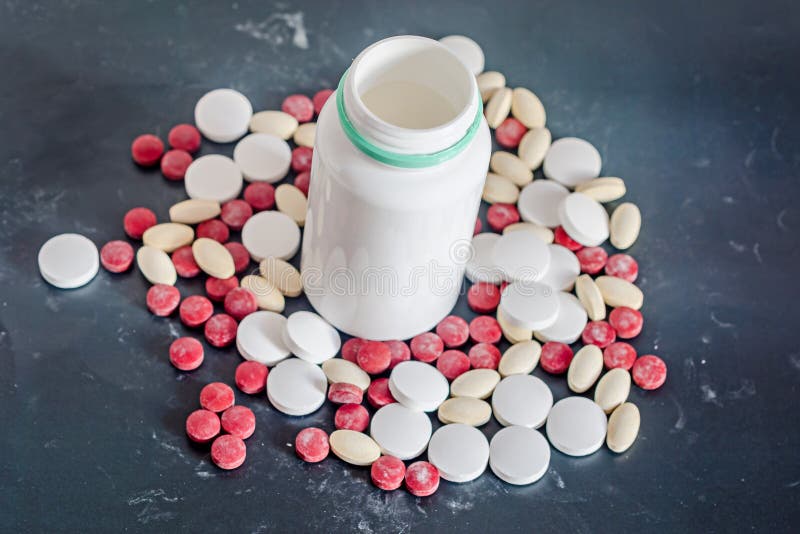 Red, White, Yellow Drugs Pills with White Open Plastic Bottle, P Stock
