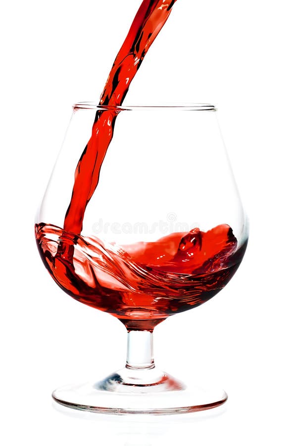 Red wine being served into a glass cup