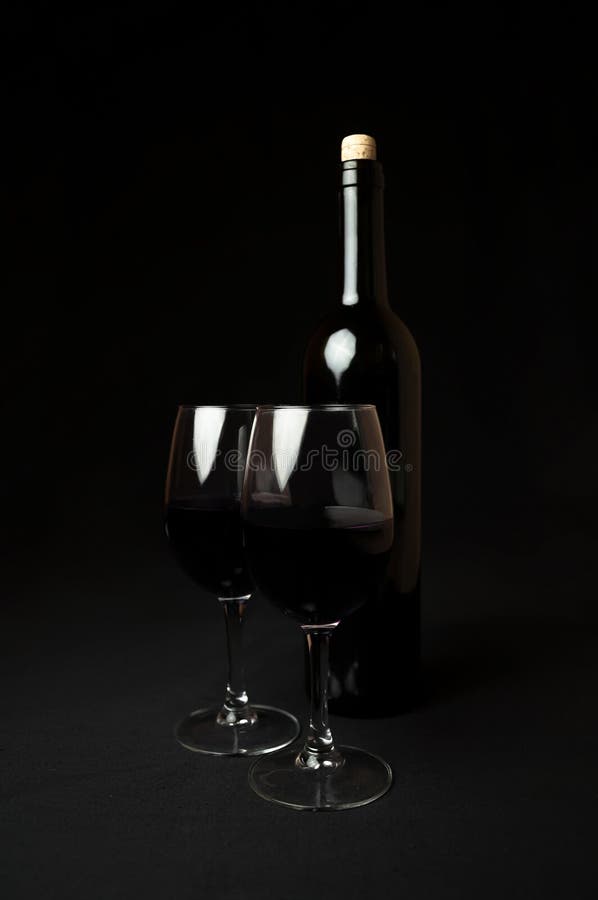 Red Wine. Two Glasses of Red Wine on Black Background Stock Image