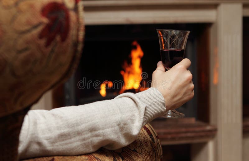 Red wine by the fireplace stock image. Image of caucasian - 17570283