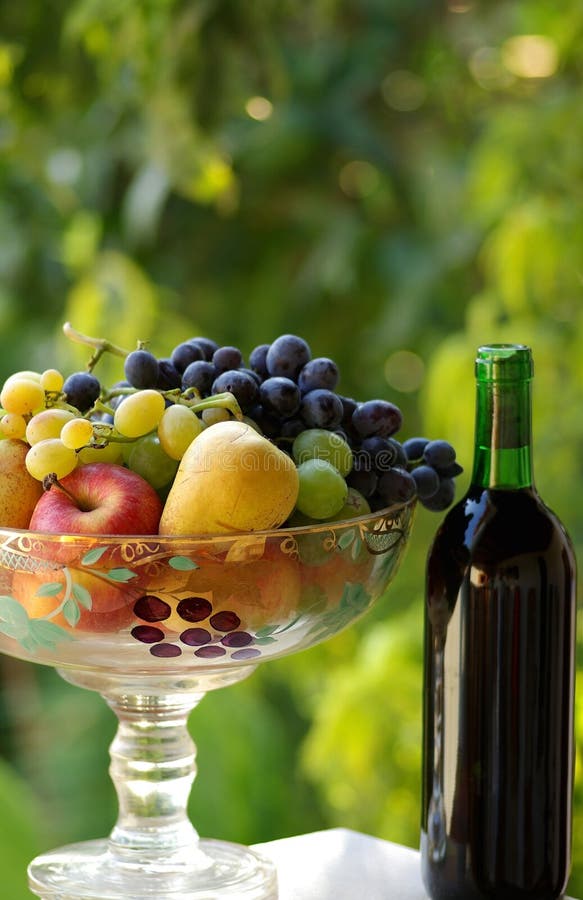 Red wine with fruit basket