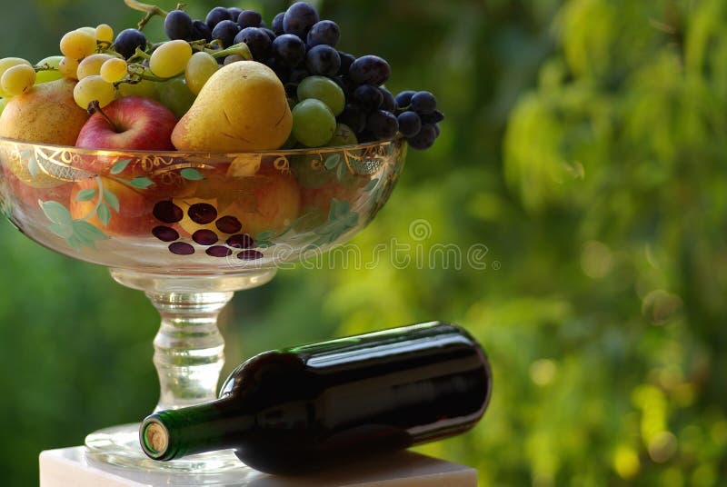 Red wine with fruit basket